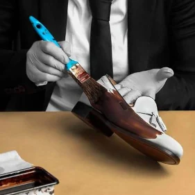 Image of a singe tassel loafer shoe in crust leather